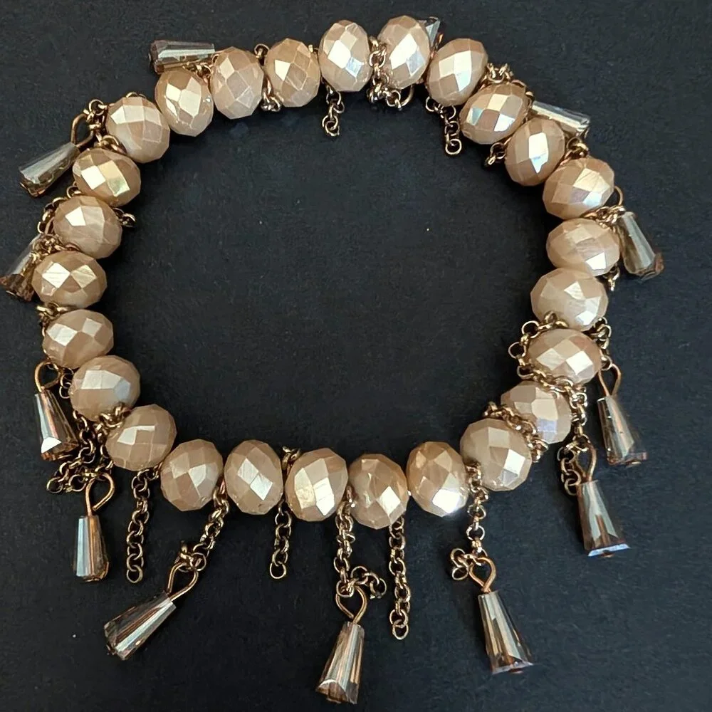 Bundle of nude and natural beaded stretch bracelets